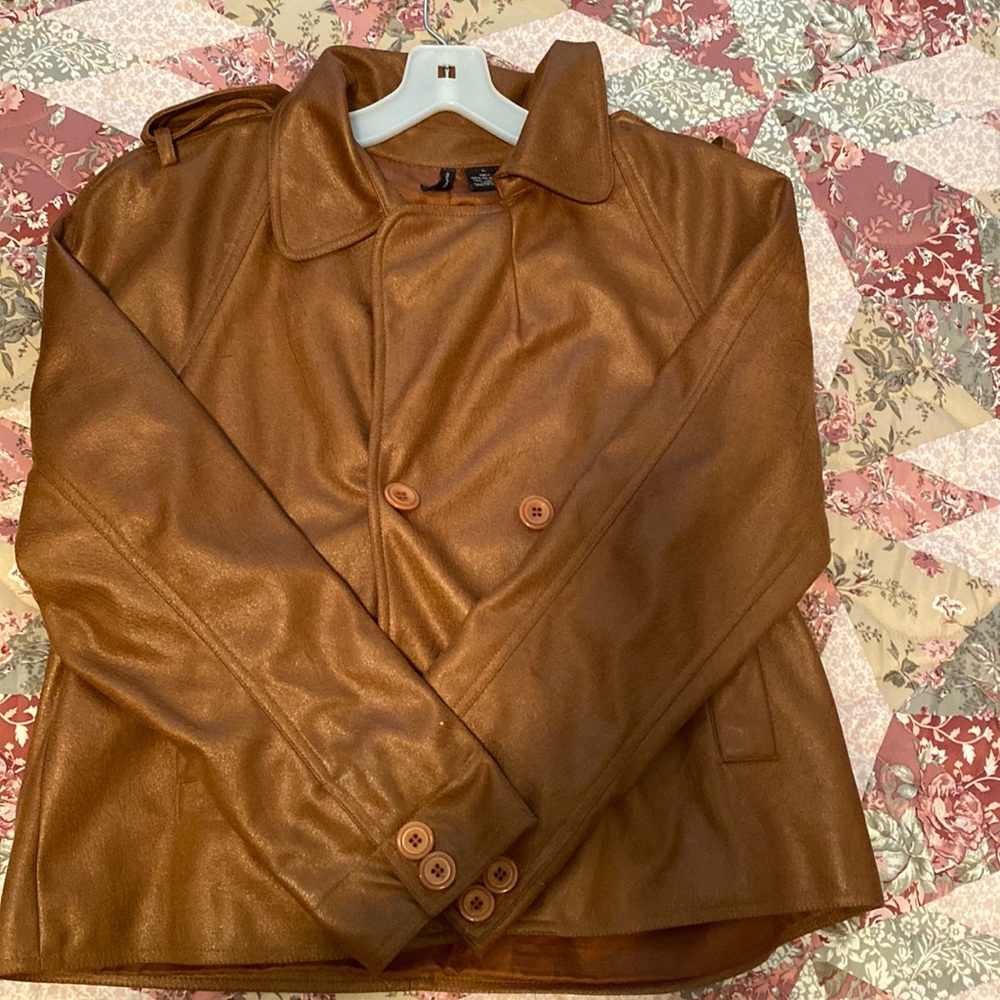 a leather coffee brown jacket in good conditions with ruffles on the back